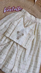 Metallic zari check lehenga paired with a embroidered halter neck crop blouse